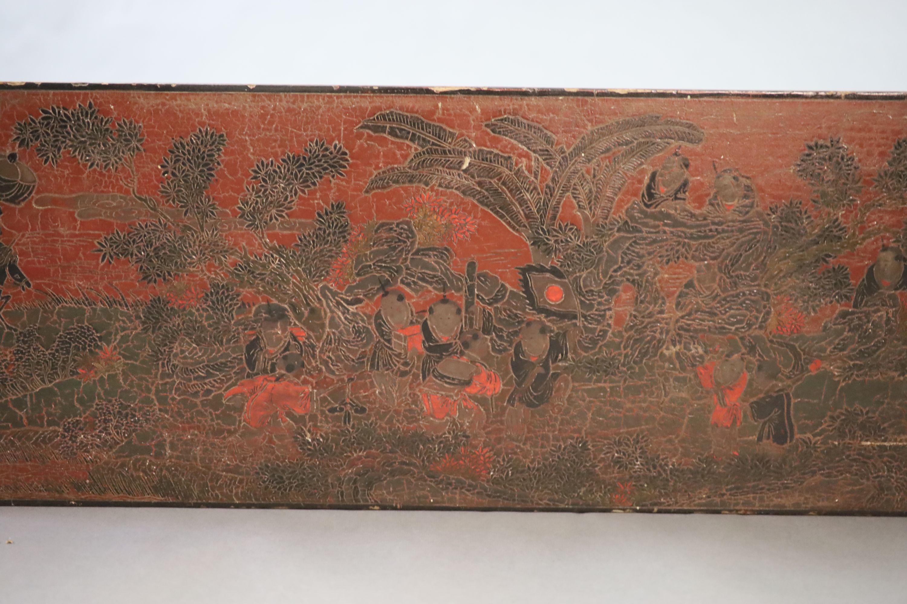 A Chinese coromandel lacquer table or stand, 18th century, 88cm long, 31.5cm long, 35cm high, losses